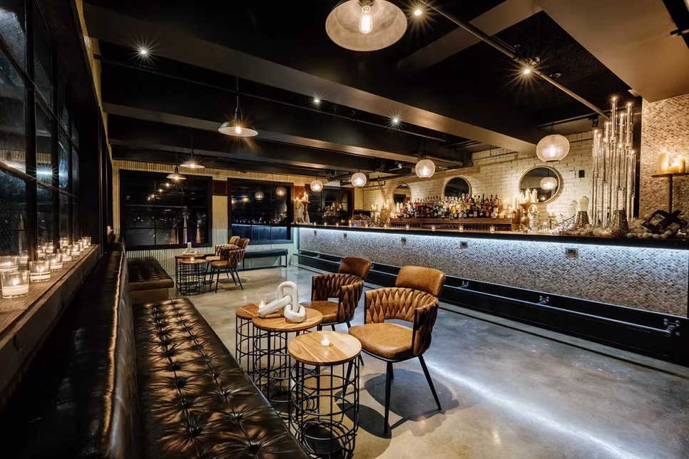 The Loft lounge, candlelit window ledge and the bar along the far wall